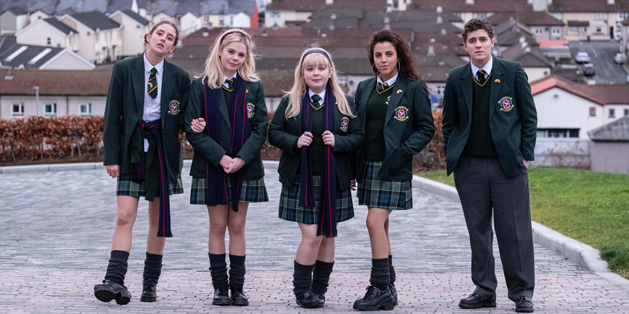 the cast of Derry Girls pose for the camera