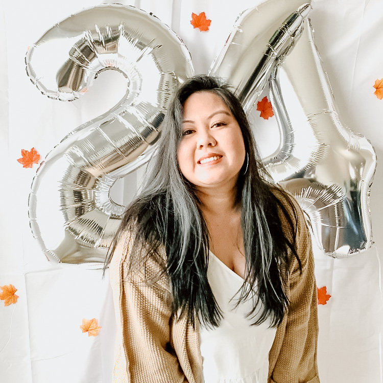 young woman with "21" balloons