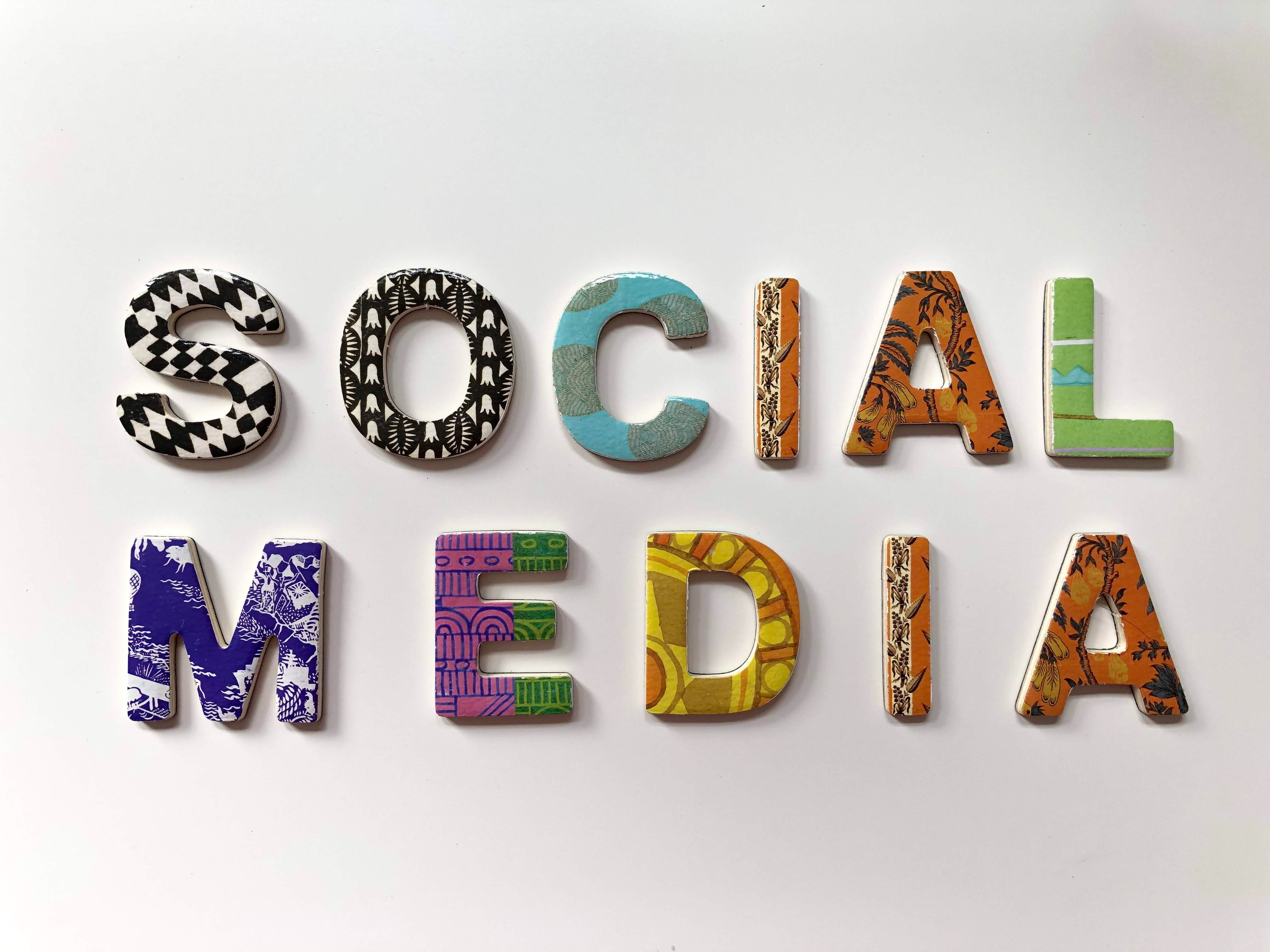 the words "social media" in pottery on a wall